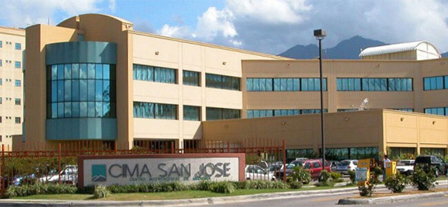 Picture of JCI- accredited CIMA Hospital, in San José, Costa Rica.  The picture is a wide panoramic view of the expansive three story hospital.