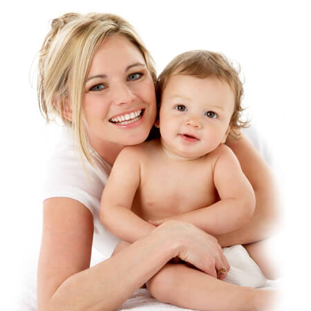 Picture of a happy mother holding her baby.  The mother is young and has blonde hair, and both are smiling and looking directly at the camera.